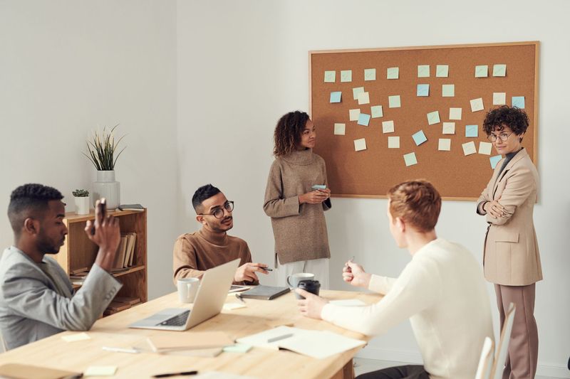 Next Target team meeting around a conference table