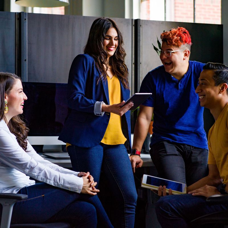 Team members talking together in the office