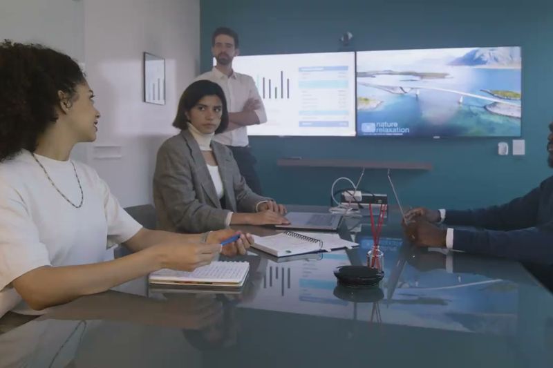 Next Target team members meeting in a conference room