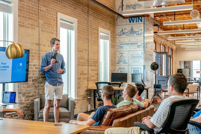 Next Target team presenting in a loft office