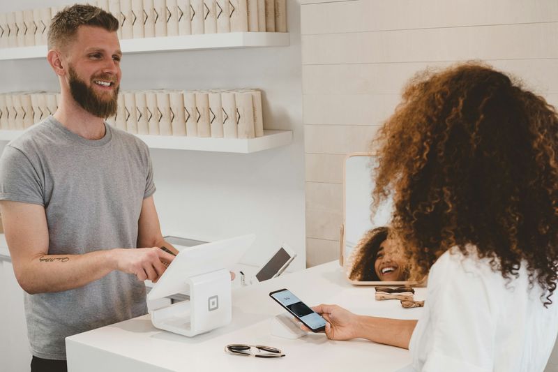 Brand representative helping a customer face to face at a counter